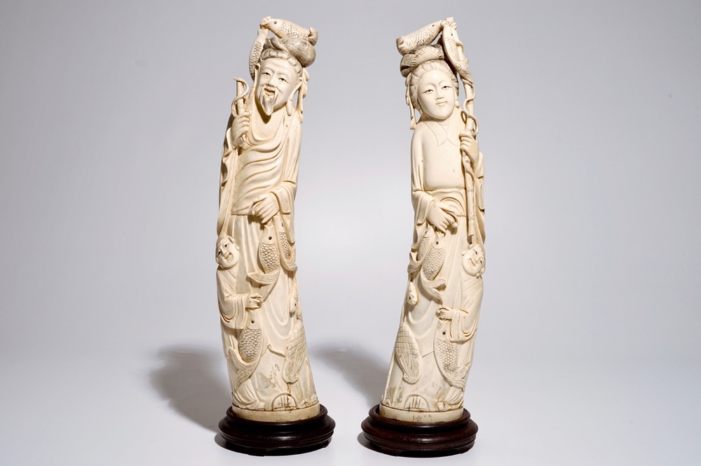 A pair of tall Chinese ivory figures of a fisherman and woman, 19/20th C.